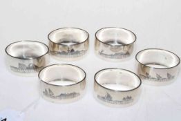 Set of six Iranian silver napkin rings decorated with boating scenes, buildings and camels.