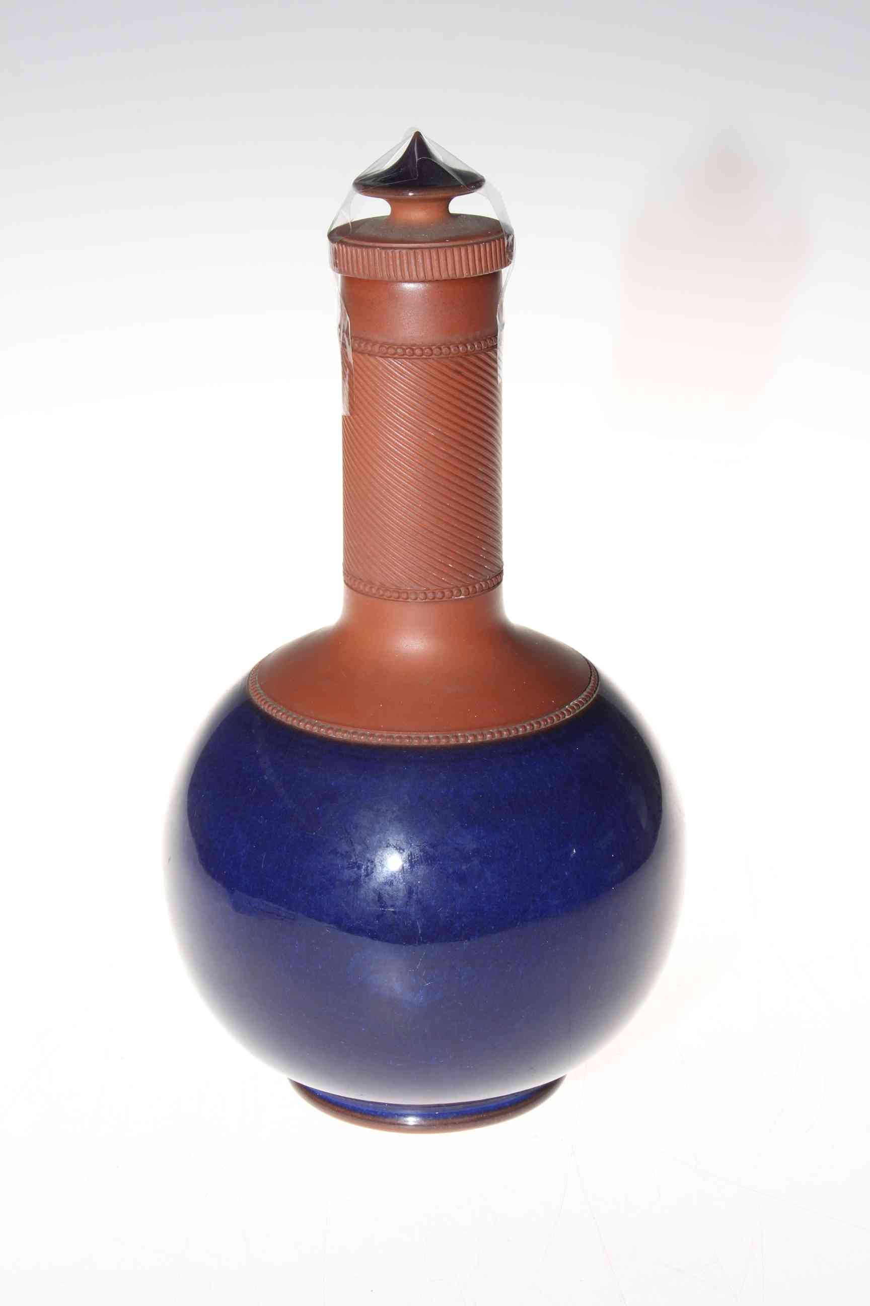Part glazed red ware bottle vase and cover.