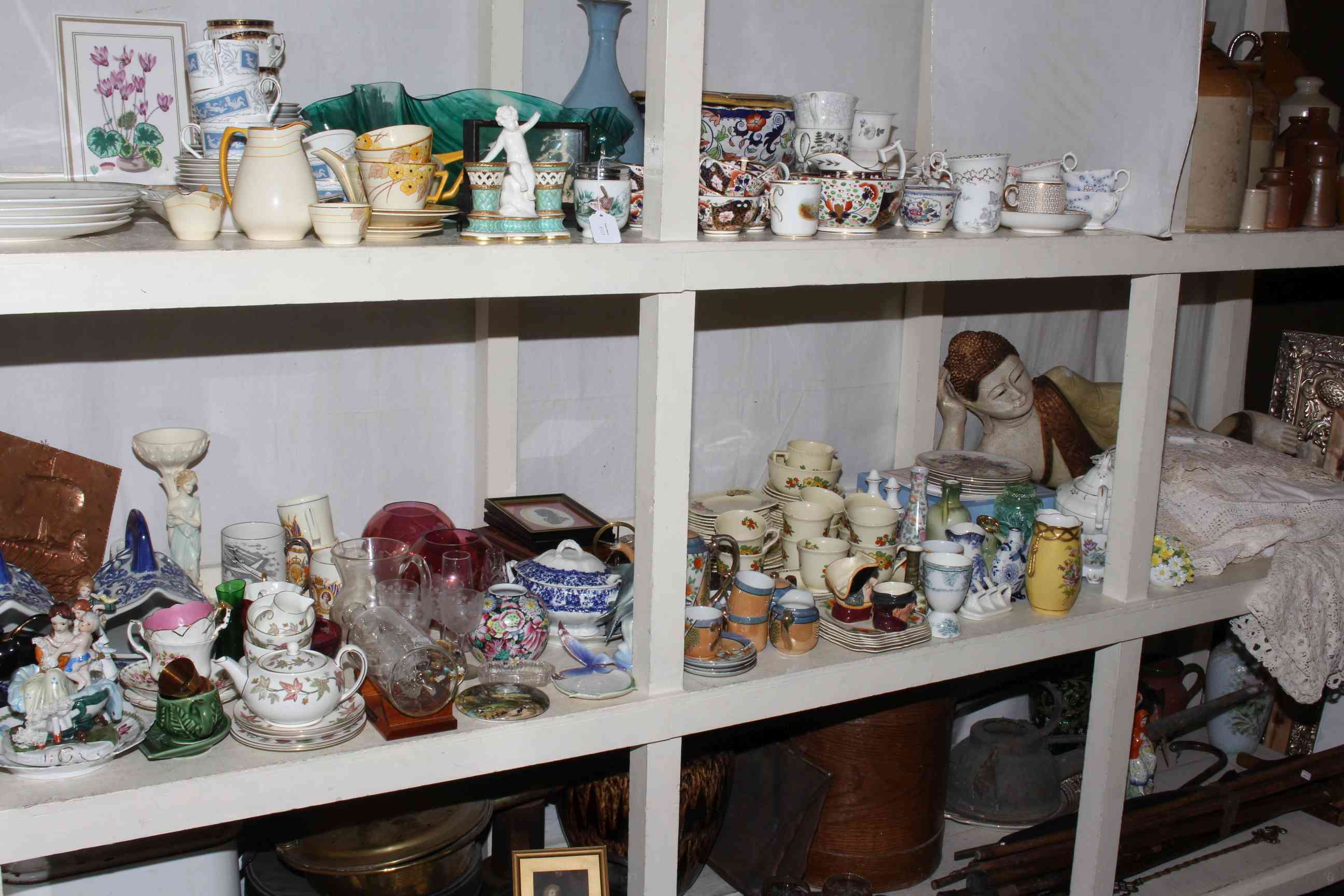 Collection of glass and china, lace cloths, figurines, Oriental plaster figure,