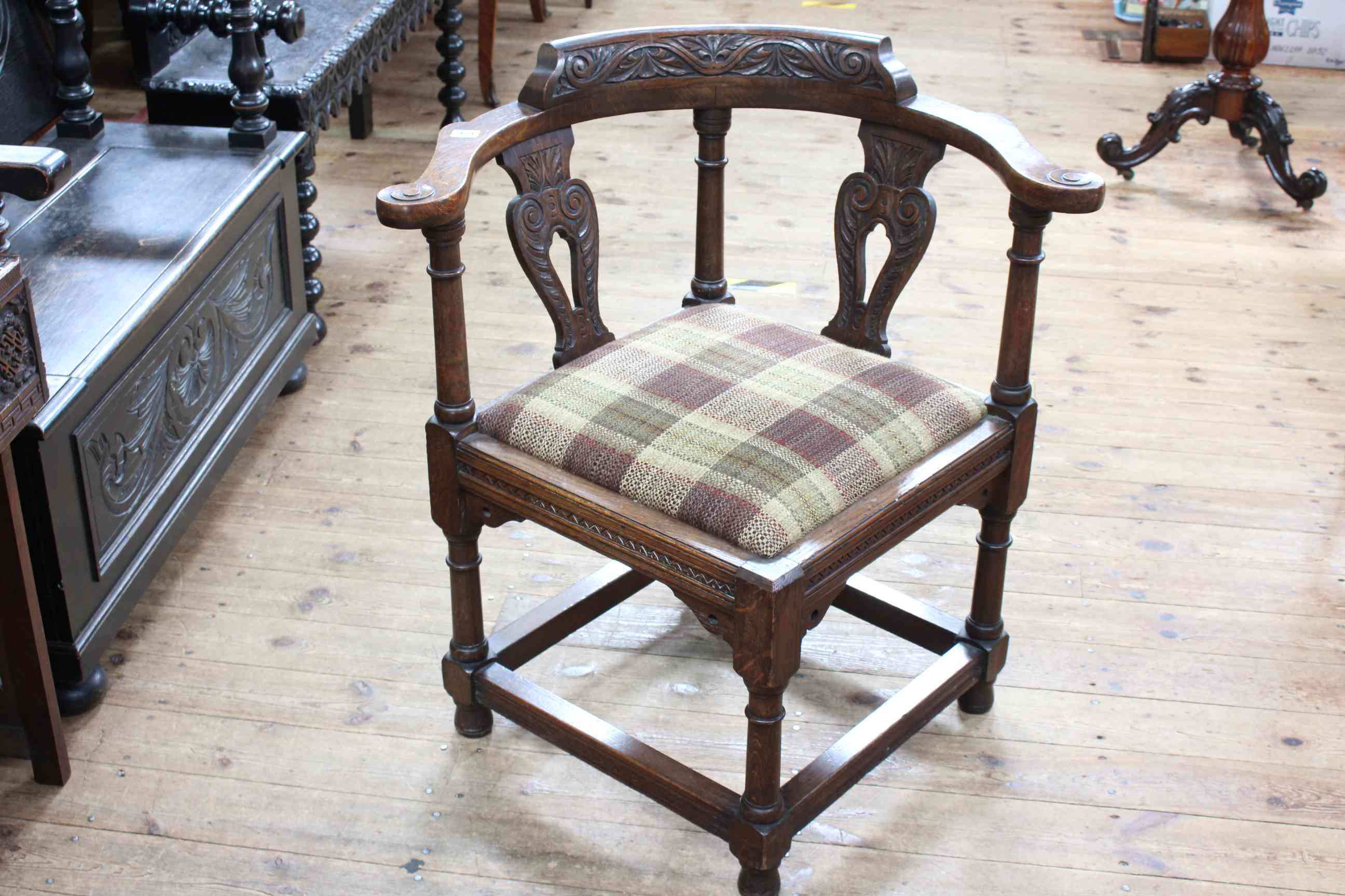 Victorian carved oak corner elbow chair on turned legs.
