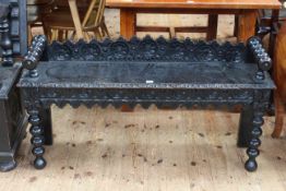 Victorian carved oak window seat on bobbin legs, 62.5cm by 120cm.