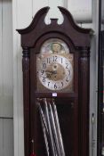 American triple weight longcase clock having arched moon phase dial.