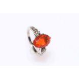 Fire opal and diamond ring set in 14 carat white gold.