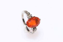 Fire opal and diamond ring set in 14 carat white gold.