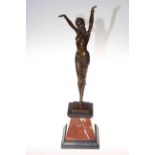 Bronze lady in a dancing pose on a marble plinth, 56cm.