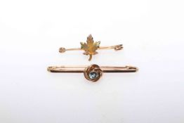 19 carat gold maple lead brooch and other.