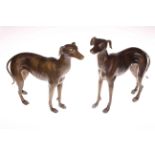 Pair of bronzed models of greyhounds.