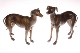Pair of bronzed models of greyhounds.