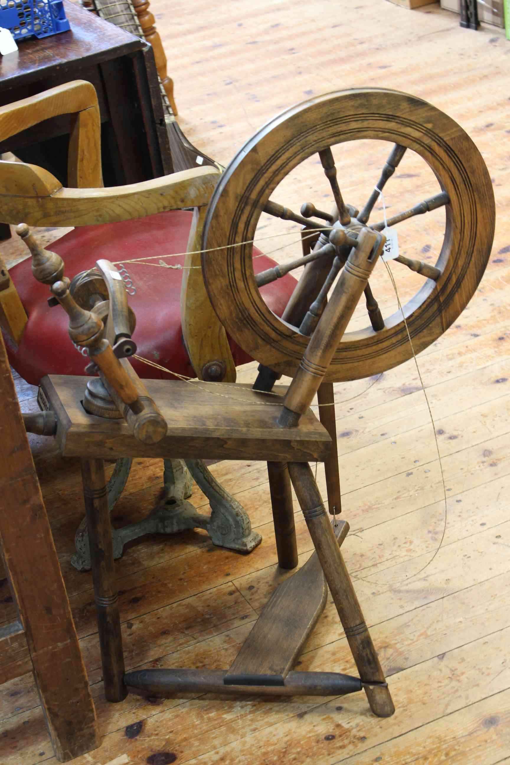 Antique style treadle spinning wheel.