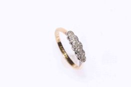 18 carat gold and five stone diamond ring.