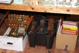 Three boxes of brass, wood plane tools and vintage football books.