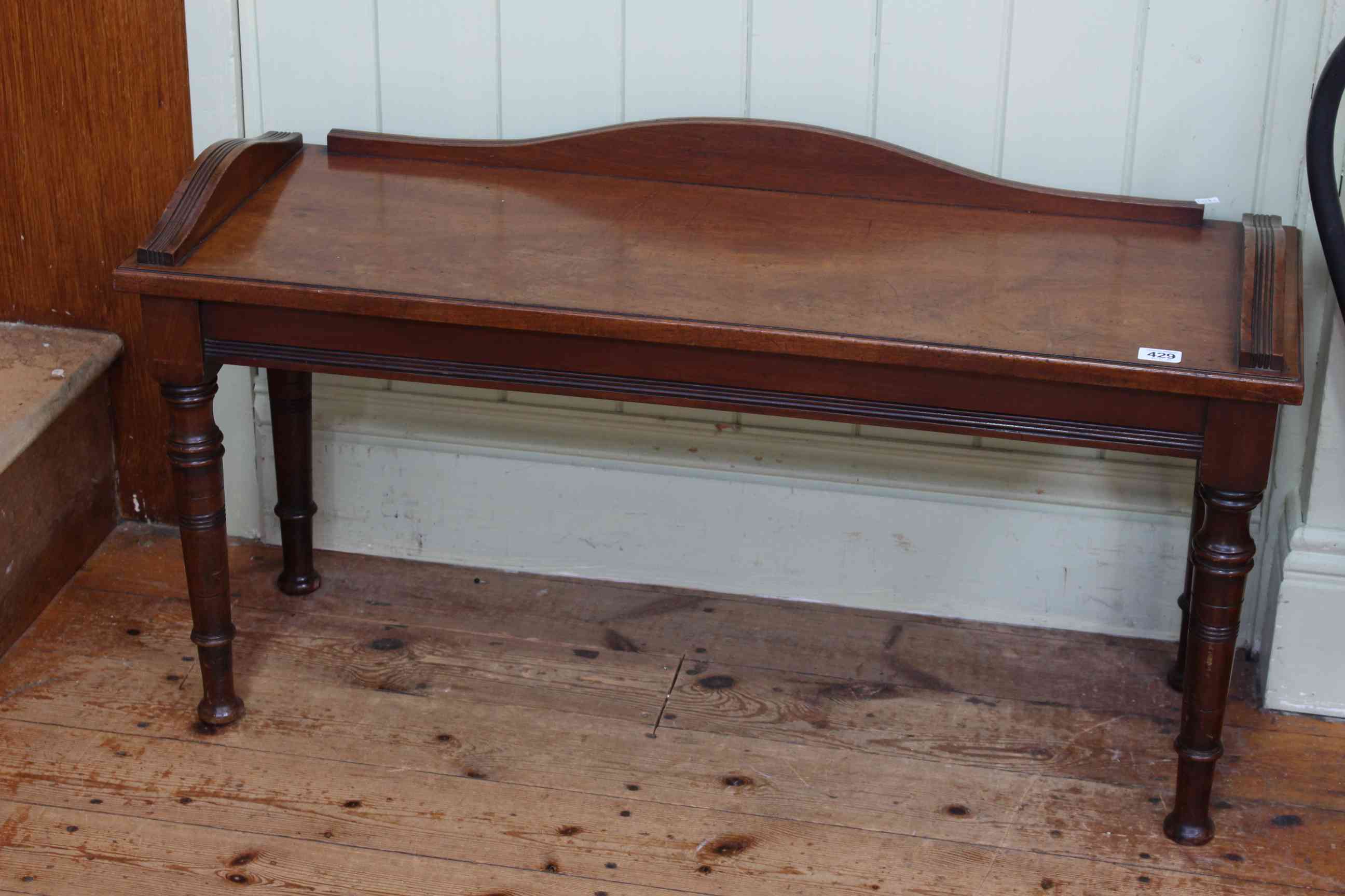 Late 19th Century walnut window seat on turned legs, 48cm by 91.5cm.