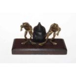 Bronze shell and two gilt frogs inkstand, the frogs with cabochon gem eggs, 16.5cm across.