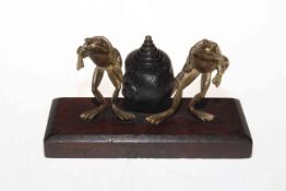 Bronze shell and two gilt frogs inkstand, the frogs with cabochon gem eggs, 16.5cm across.