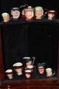 Thirteen Royal Doulton character jugs including Town Crier, Cardinal.