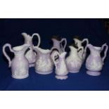 Collection of eight Samuel Alcock lavender and white Parian jugs,