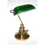 Brass desk lamp with a green glass shade, 36cm.