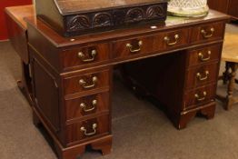 Mahogany eight drawer pedestal desk, 122cm by 79.5cm.