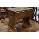 Small oak drop leaf table, the end supports having cut out rose carving and twist pillars,