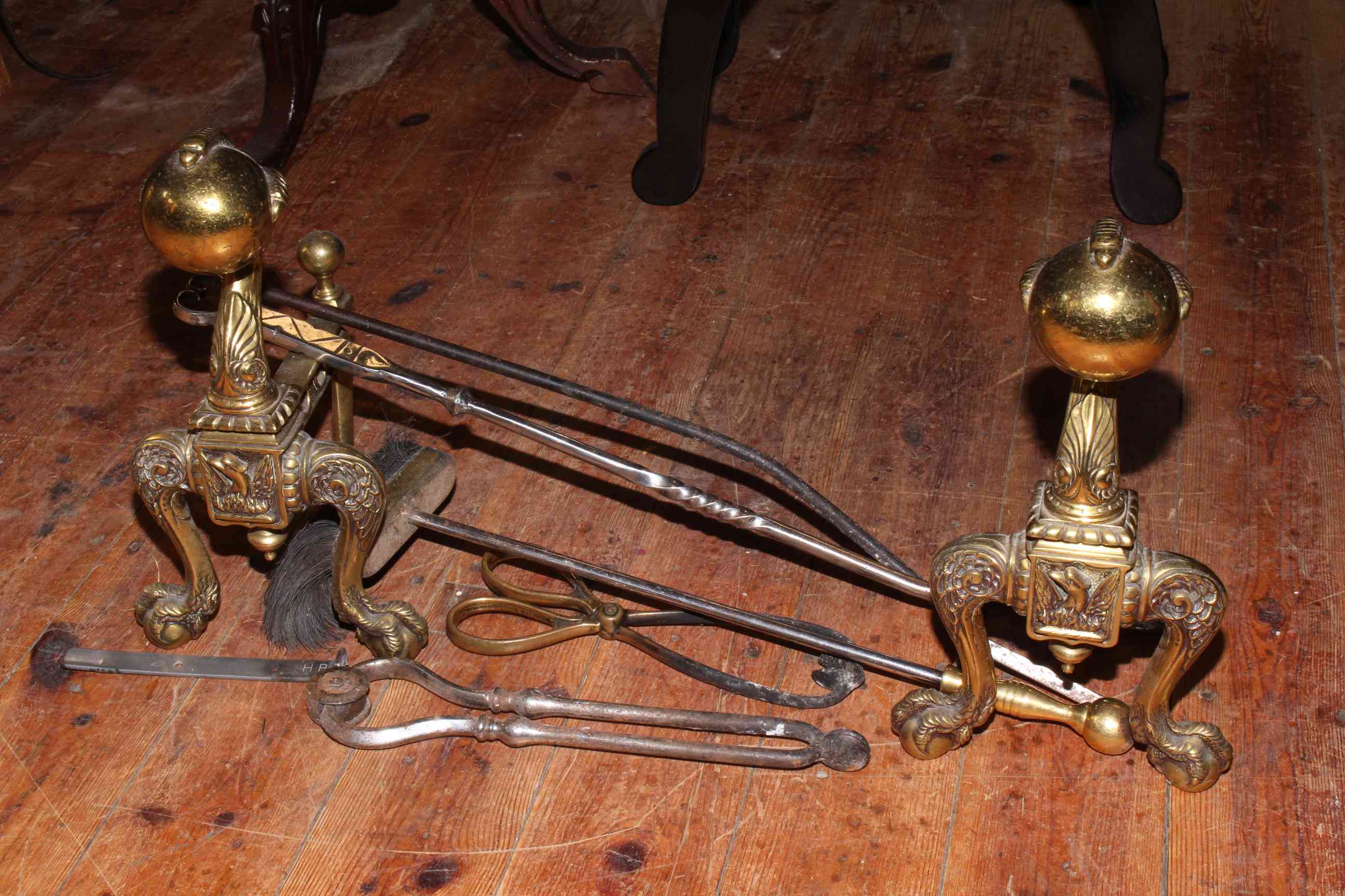 Handsome pair of Victorian brass ball and claw andirons together with five fire irons.