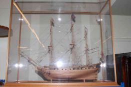 Glass cased wooden galleon, 95cm by 84cm by 36cm.