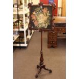 Victorian mahogany adjustable tripod pole screen with glazed needlework panel.