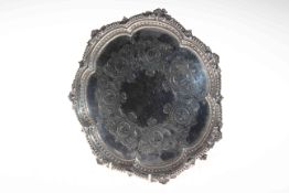 Edwardian silver salver with engraved decoration and ornate border, London 1909, 26cm diameter.