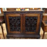 19th Century Continental carved rosewood bookcase having two vine carved fretwork doors enclosing