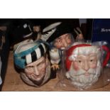 Four Royal Doulton character jugs including Santa Claus (with box) and The Falconer.