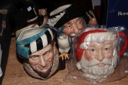 Four Royal Doulton character jugs including Santa Claus (with box) and The Falconer.