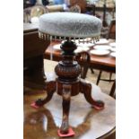 Victorian revolving piano stool on carved tripod base.