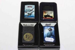 Four Zippo lighters.