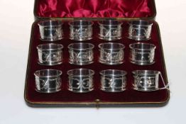 Edwardian cased set of twelve silver napkin rings,
