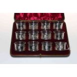 Edwardian cased set of twelve silver napkin rings,