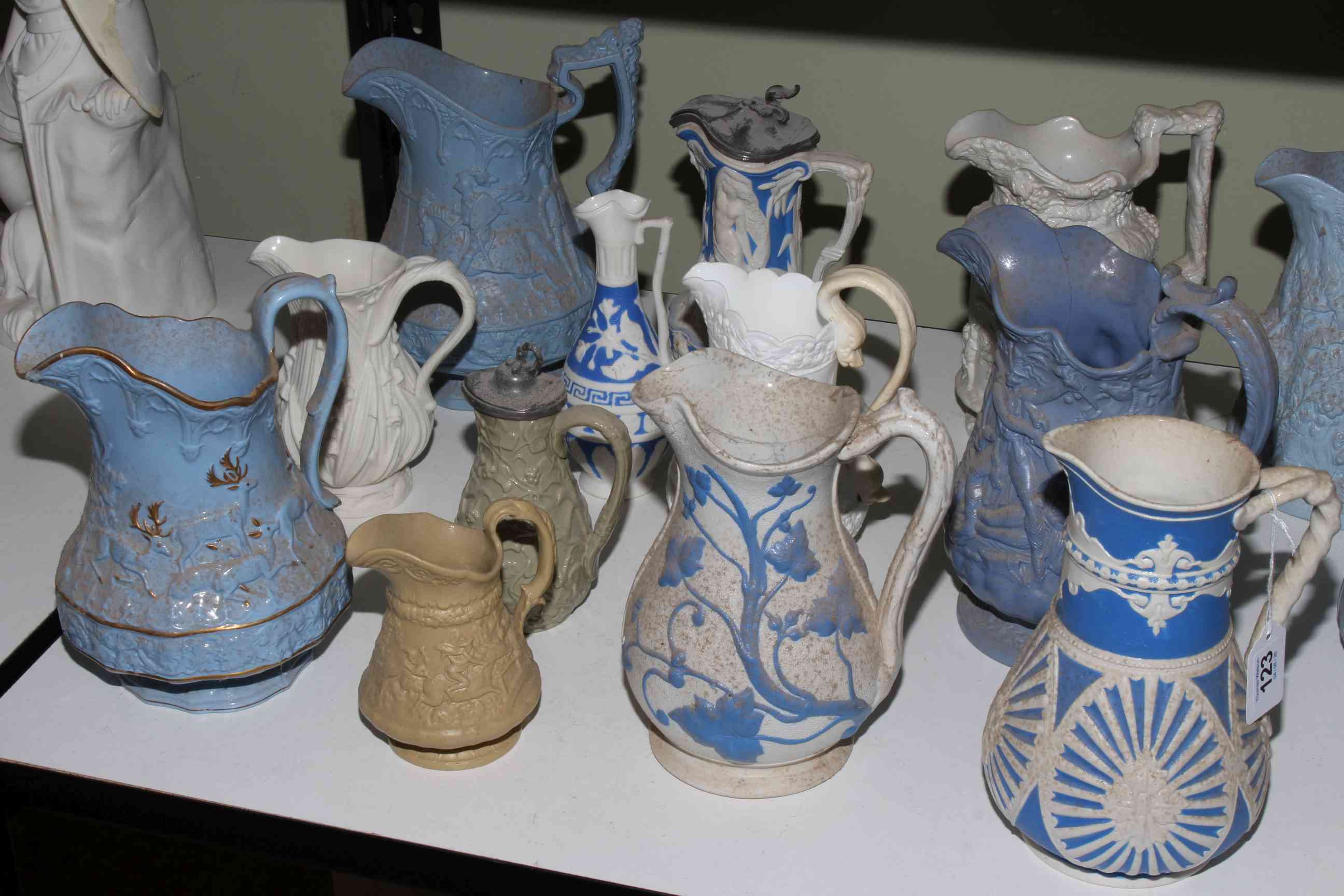 Collection of twenty one Victorian relief moulded jugs, mostly stoneware including Charles Meigh, - Image 3 of 3
