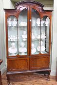 Edwardian mahogany arched top vitrine having two glazed panel doors above two cupboard doors on