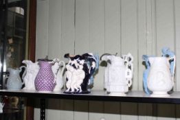 Good collection of ten Victorian stoneware and Parian relief moulded jugs, including Charles Meigh,