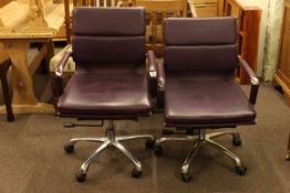 Pair burgundy adjustable swivel office armchairs.