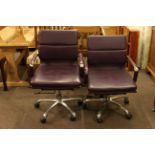 Pair burgundy adjustable swivel office armchairs.