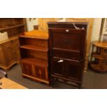 1920's oak fall front writing cabinet and yew waterfall cabinet bookcase.