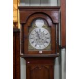 19th century oak eight day longcase clock, having brass arched dial signed W.