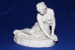 Victorian Parian figure of maiden reclining beside water, length 30cm, height 28cm.