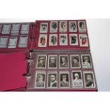 Two albums of full and part set Ogden's cigarette cards including By The Roadside,