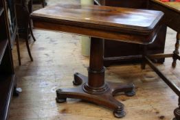 Victorian rosewood fold top card table on turned pedestal to quadriform base, 92cm by 74.