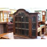 Dutch floral marquetry arched top and glazed panel wall cabinet with canted corners, 111.