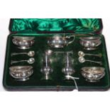 Boxed silver seven piece condiment set, complete with onslow pattern salt spoons, Birmingham 1898.