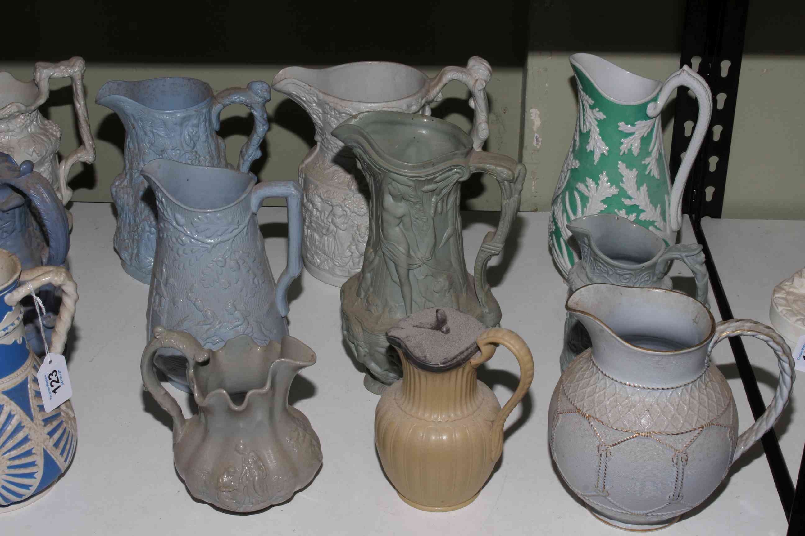 Collection of twenty one Victorian relief moulded jugs, mostly stoneware including Charles Meigh, - Image 2 of 3
