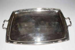 Large silver two handled tea tray of curved sided rectangular shape, Sheffield 1942, 62cm across.