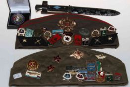 Two military caps and various badges, dagger and enamelled silver Georgian crown brooch.