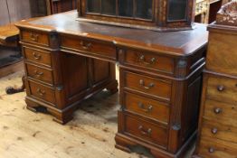 Reproduction mahogany inverted breakfront partners desk having six frieze drawers and drawers and